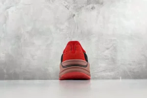 Adidas Yeezy Boost 700 V2 red black suede leather sneakers rear view on gray background