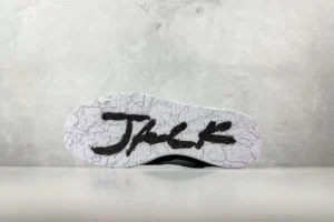Nike Air Jordan 4 Retro black white leather sneakers with signature "JACK" on outsole