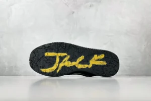 Nike Air Jordan 4 Retro black outsole with yellow Jack text signature rubber sole sneakers