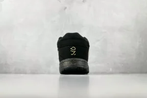 Nike Air Jordan 1 Low black colorway textile leather sneakers with speckled patterned sole