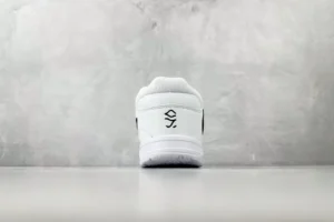 Nike Air Force 1 Low white black leather sneakers rear view on grey background