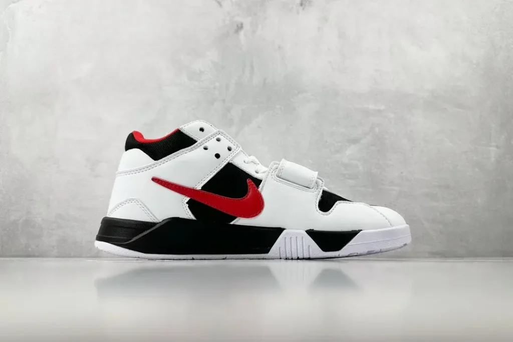 Nike Air Trainer 1 black white red leather sneakers with mid-top design and velcro strap closure