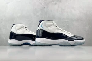 Nike Air Jordan 11 Retro Concord white black patent leather sneakers with icy blue sole