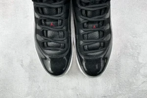 Nike Air Jordan 11 Retro Black Concord black patent leather and mesh sneakers