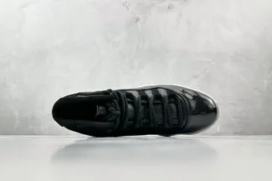 Nike Air Jordan 11 Retro 378037-005 black patent leather and mesh sneaker