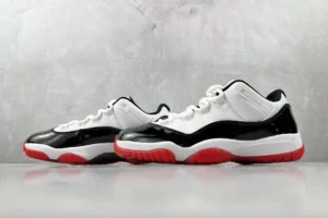 Nike Air Jordan 11 Low Concord black white red patent leather sneakers with rubber sole
