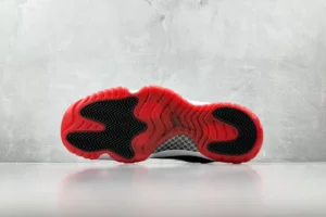 Nike Air Jordan 11 Retro Bred black red white patent leather sneakers outsole view