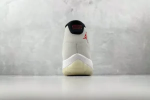 Nike Air Jordan 11 Retro platinum tint white black red leather sneakers rear view