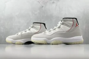 Nike Air Jordan 11 Retro OG Neutral Grey white black red leather sneakers with translucent outsole