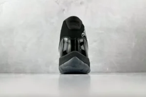 Nike Air Jordan 11 Retro Black patent leather sneakers with mesh upper and translucent sole