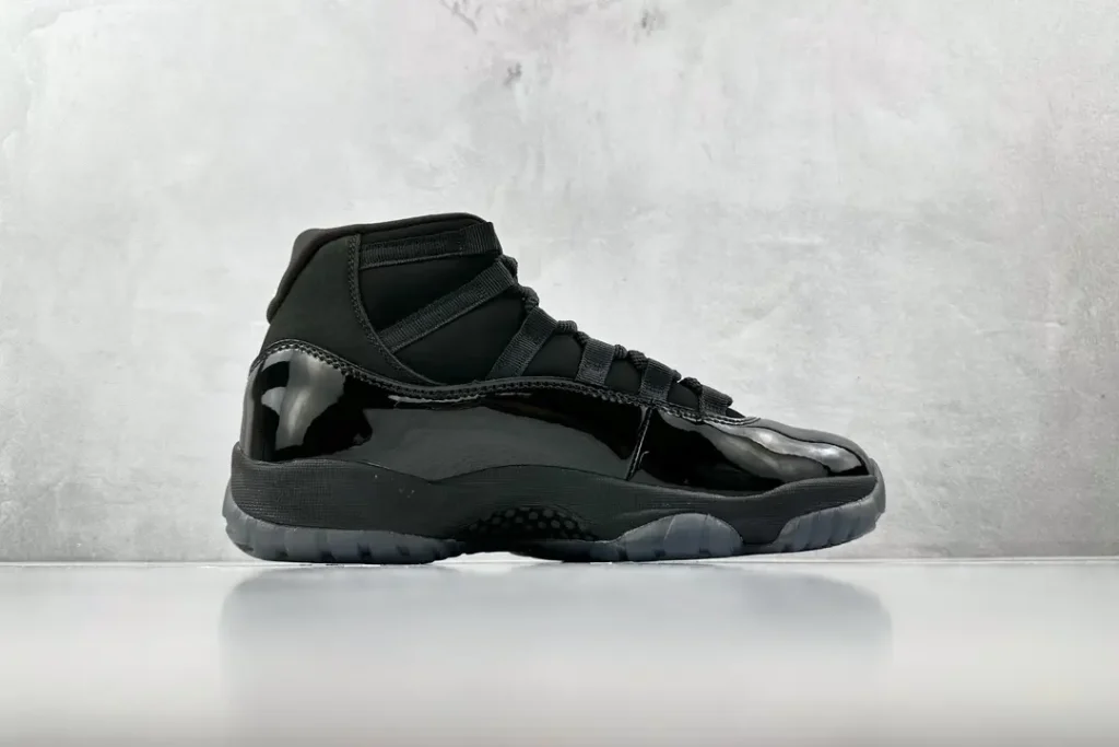Nike Air Jordan 11 Retro Cool Grey black patent leather sneakers with mesh upper and translucent outsole