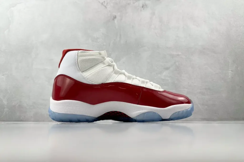 Nike Air Jordan 11 Retro Cherry varsity red white patent leather sneakers with translucent sole