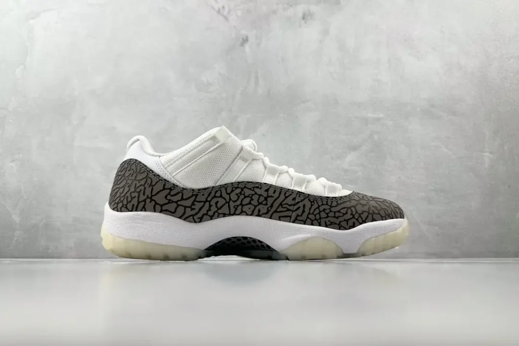 Nike Air Jordan 11 Low IE white black elephant print leather sneakers