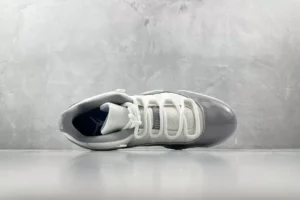 Nike Air Jordan 11 Cool Grey white grey patent leather sneakers with mesh upper and carbon fiber details