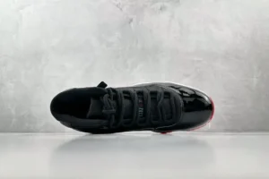 Nike Air Jordan 11 Retro Bred black red white patent leather sneakers with mesh upper and carbon fiber plate