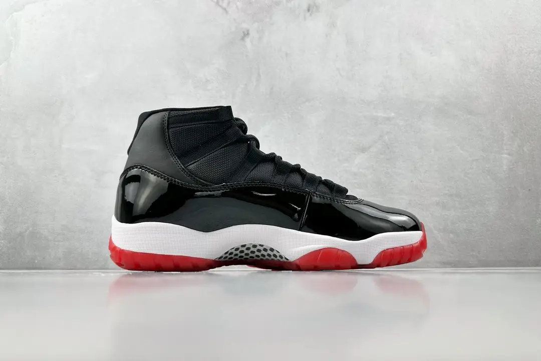 Nike Air Jordan 11 Retro Bred black red white patent leather sneakers with translucent outsole