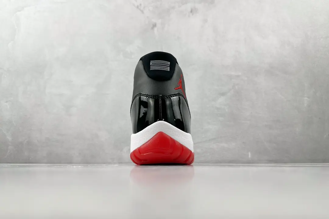 Nike Air Jordan 11 Retro Bred black red white patent leather sneakers rear view
