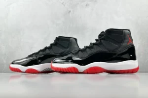 Nike Air Jordan 11 Retro Black Red white patent leather sneakers with mesh upper and rubber sole