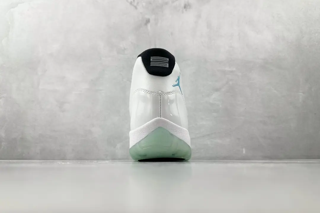 Nike Air Jordan 11 Retro Legend Blue white blue patent leather sneakers viewed from heel