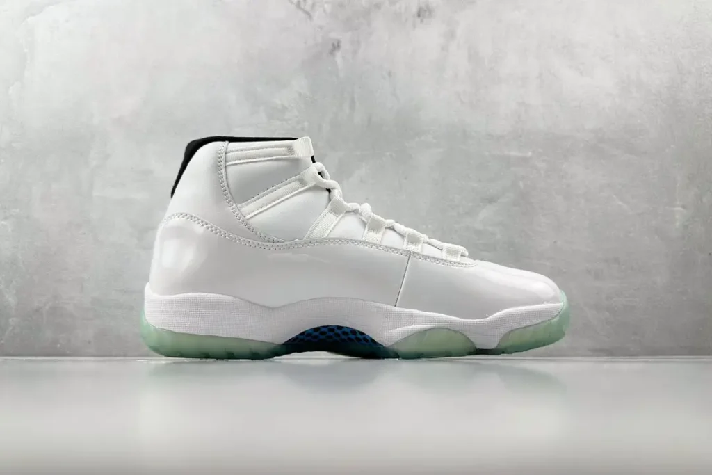 Nike Air Jordan 11 Concord white black patent leather sneakers with translucent sole and mesh accents