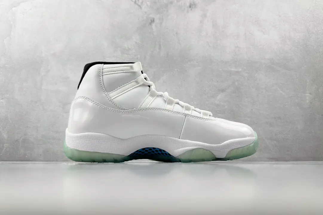 Nike Air Jordan 11 Concord white black patent leather sneakers with translucent sole and mesh accents