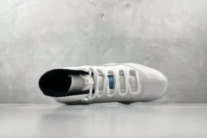 Air Jordan 11 Retro Concord white black patent leather sneakers with mesh upper details