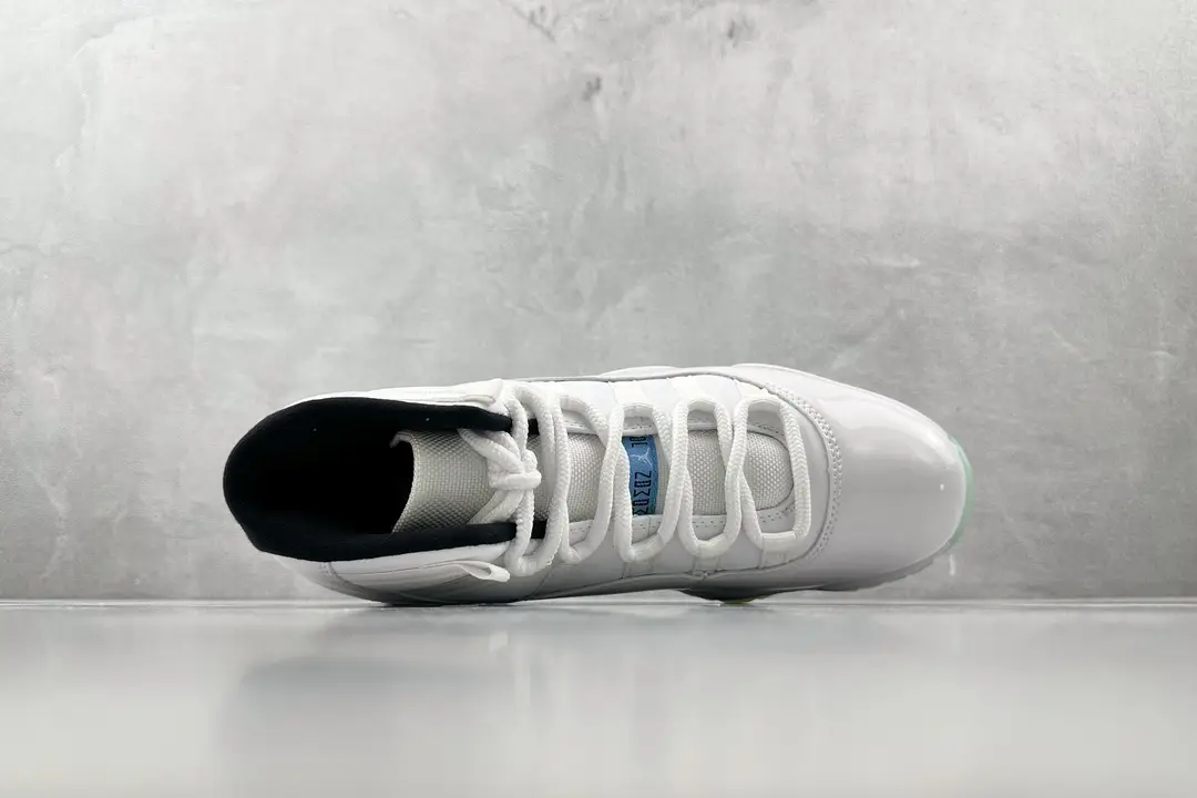 Air Jordan 11 Retro Concord white black patent leather sneakers with mesh upper details