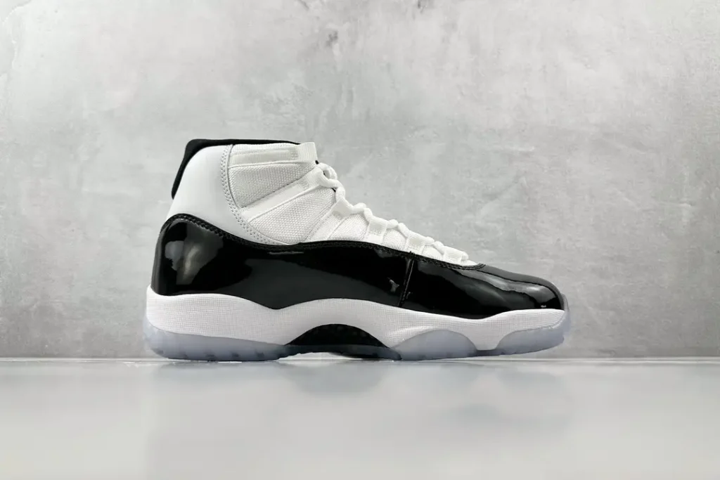 Nike Air Jordan 11 Retro Concord white black patent leather sneakers with icy sole