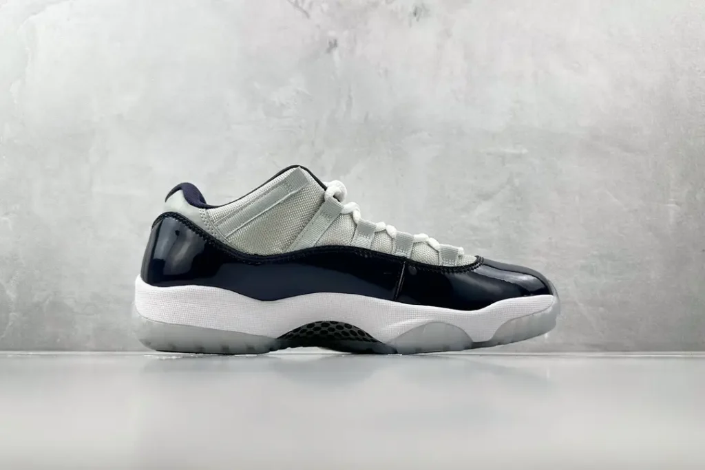 Nike Air Jordan 11 Low Concord black white patent leather sneakers with mesh upper and translucent outsole