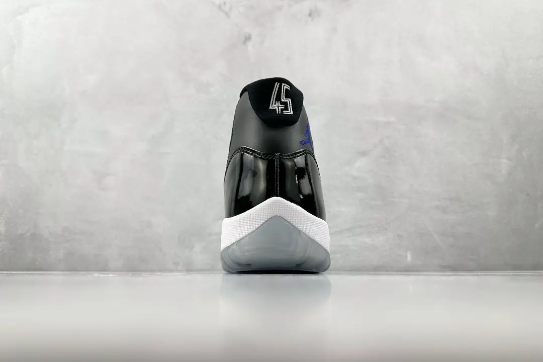 Air Jordan 11 Concord black white varsity royal patent leather sneakers rear view