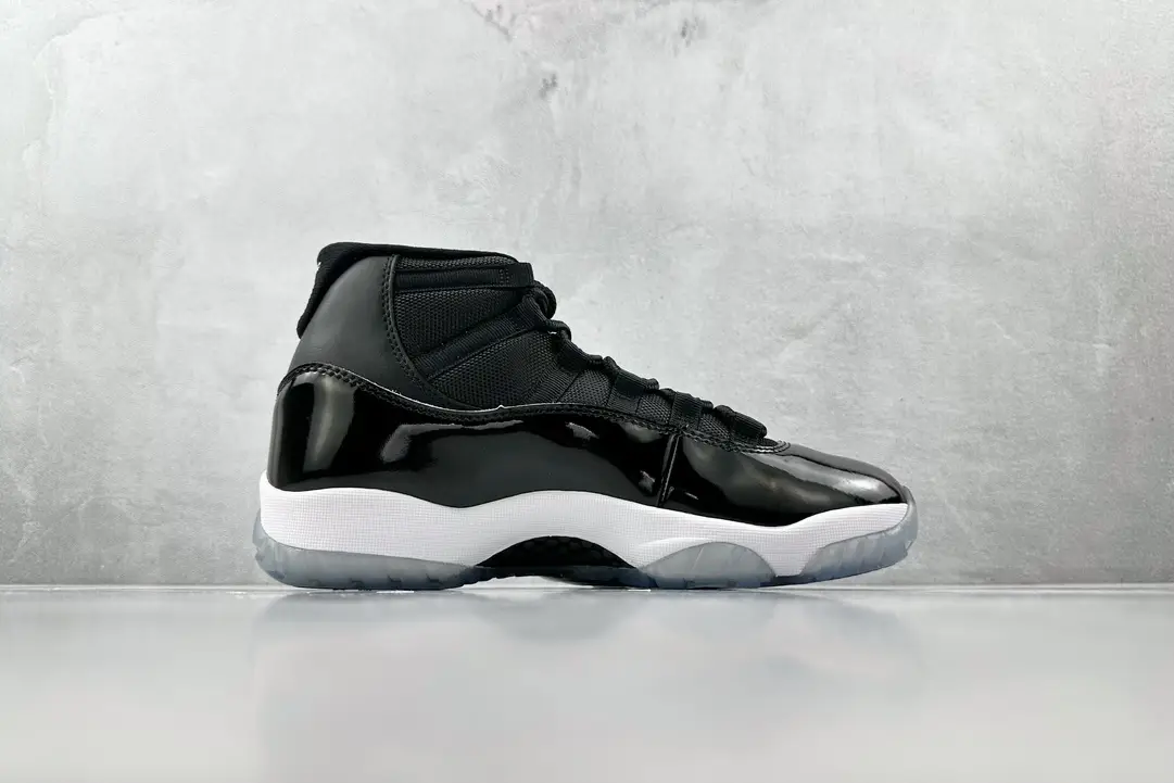 Nike Air Jordan 11 Retro black patent leather sneakers with white midsole and icy translucent outsole