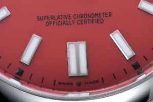 Rolex Oyster Perpetual 124300 red dial stainless steel watch with luminous markers