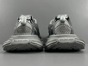 Silver Grey Balenciaga 3XL Mesh Strap sneakers showcasing rear view, featuring brand logo and textured details, emphasizing luxury footwear design.