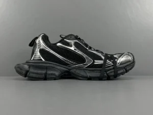 Black and silver Balenciaga 3XL mesh strap sneakers displayed from the side, showcasing the sleek design and intricate detailing, emphasizing luxury footwear features.