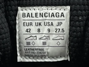 Balenciaga size label showing EUR, UK, USA, and JP sizes 42, 8, 9, and 27.5, with care instructions and "Leatherfree" designation.