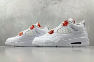 Nike Jordan 4 Retro 308497-108 white orange leather sneaker with mesh detailing and rubber sole