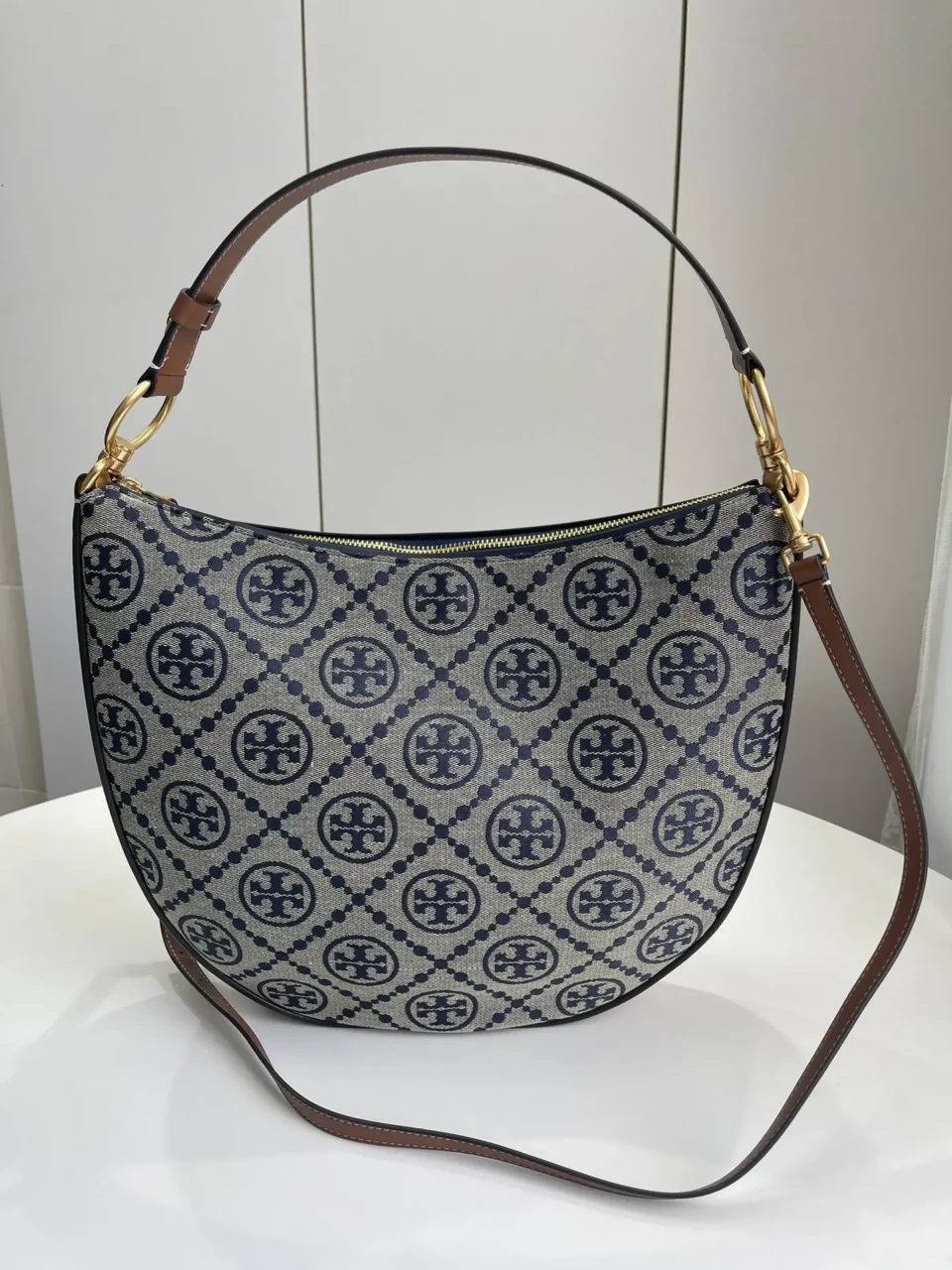 Tory Burch Half Moon 14-inch navy beige logo jacquard canvas bag brown leather trim