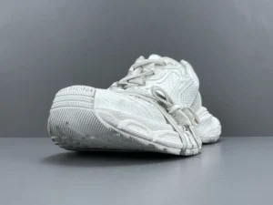 White Grey Balenciaga 3XL Mesh Strap sneaker displayed at an angle, showcasing its unique design and texture.