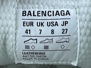 Balenciaga shoe tag showing size information for EUR 41, UK 7, USA 8, and JP 27, with leather-free label and care symbols.