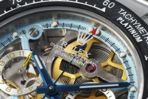 Rolex Oyster Perpetual Cosmograph blue dial platinum tachymeter bezel stainless steel watch mechanism close-up