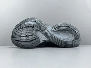 Bottom view of Balenciaga 13th Generation CIRCUIT print sneakers, showcasing textured rubber sole and tread design, emphasizing functionality and style.