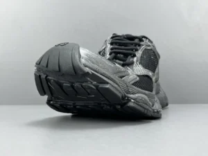 Balenciaga Parisian Stapler shoes featuring a thick round head and textured upper, angled view showcasing sole and lacing details, designed for luxury sneaker enthusiasts.