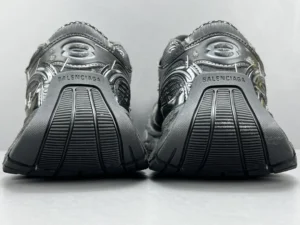 Balenciaga Parisian Stapler dad shoes showcasing rear view with distinctive logo and textured sole design.