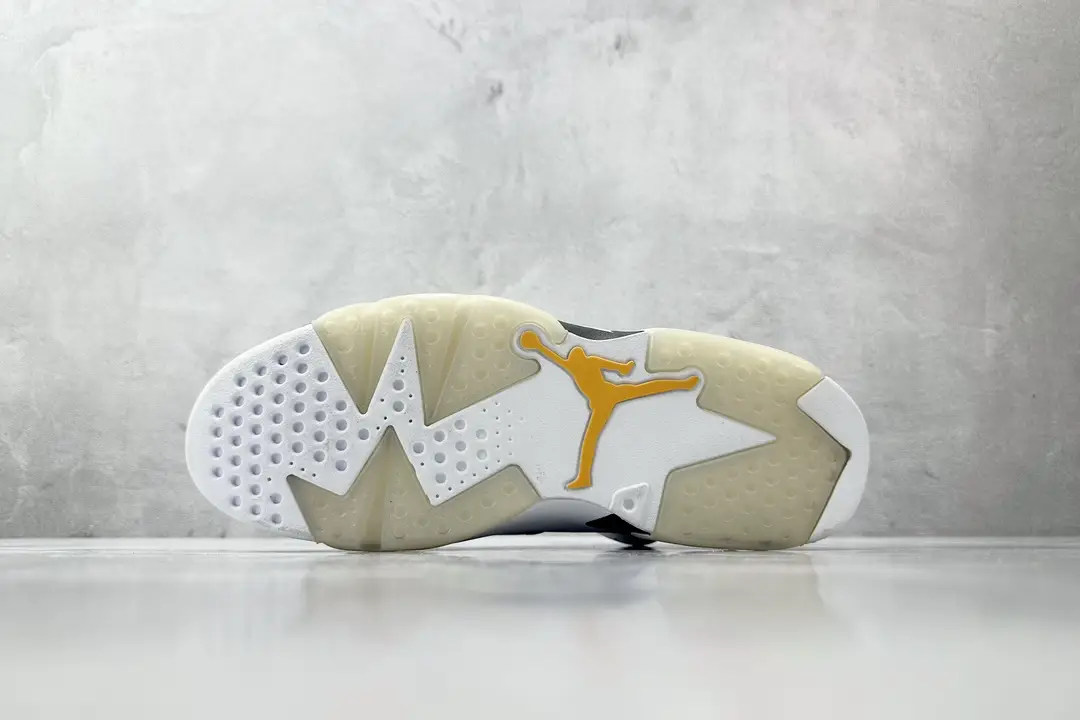 Nike Jordan 6 Retro White University Gold Black leather and synthetic sneaker outsole view