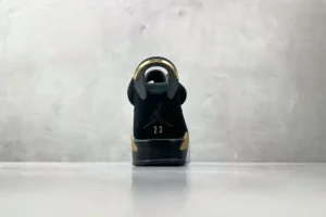 Nike Jordan 6 Retro DMP Style CT4954-007 black and metallic gold suede sneaker with rubber sole