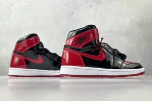 Nike Air Jordan 1 Retro High OG Bred patent leather sneakers in black and red with white soles
