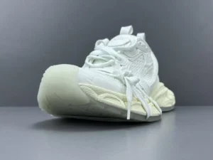 Balenciaga 3XL Mesh sneakers in white featuring a unique design with a chunky sole and lace-up closure, displayed against a gray background.