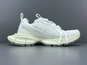 Balenciaga 3XL Mesh sneakers in white, featuring a mesh upper and chunky sole, displayed on a gray background, highlighting luxury design and modern aesthetic.