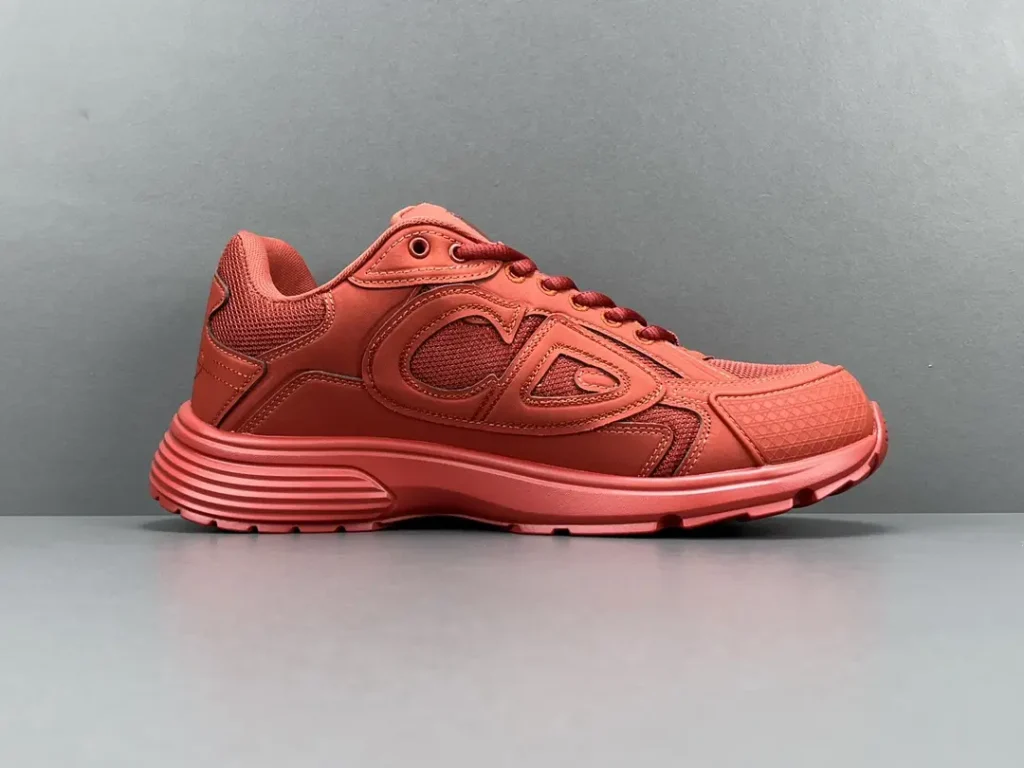 C.D.G. Motion Mesh red leather sneakers with textured detailing and rubber sole