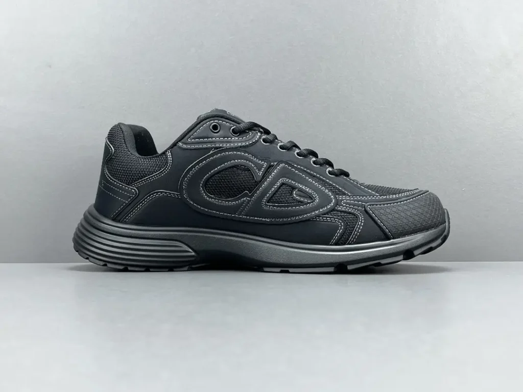Chanel CC Black Runner black leather and mesh sneakers with contrast stitching and rubber sole